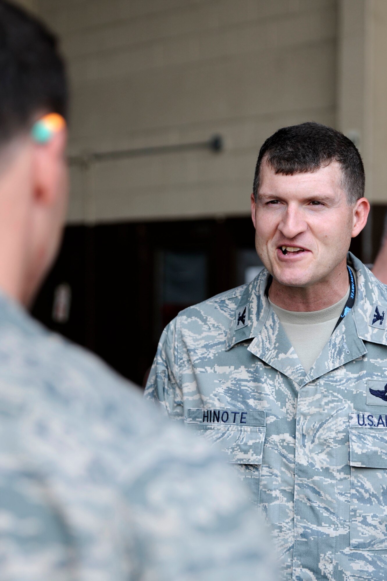 KUNSAN AIR BASE, Republic of Korea – Col. S. Clinton Hinote, 8th Fighter Wing commander, speaks with Senior Airman Enrique Melgarejo, 80th Aircraft Maintenance Unit crew chief, after a weapons load crew competition at Kunsan Air Base, Republic of Korea, May 23, 2013. More than 70 Wolf Pack Airmen and leadership watched as crew chief’s from the 80th and 35th AMU’s competed for bragging rights and to show who the best team was. (U.S. Air Force photo by Staff Sgt. Tong Duong/ Released) 