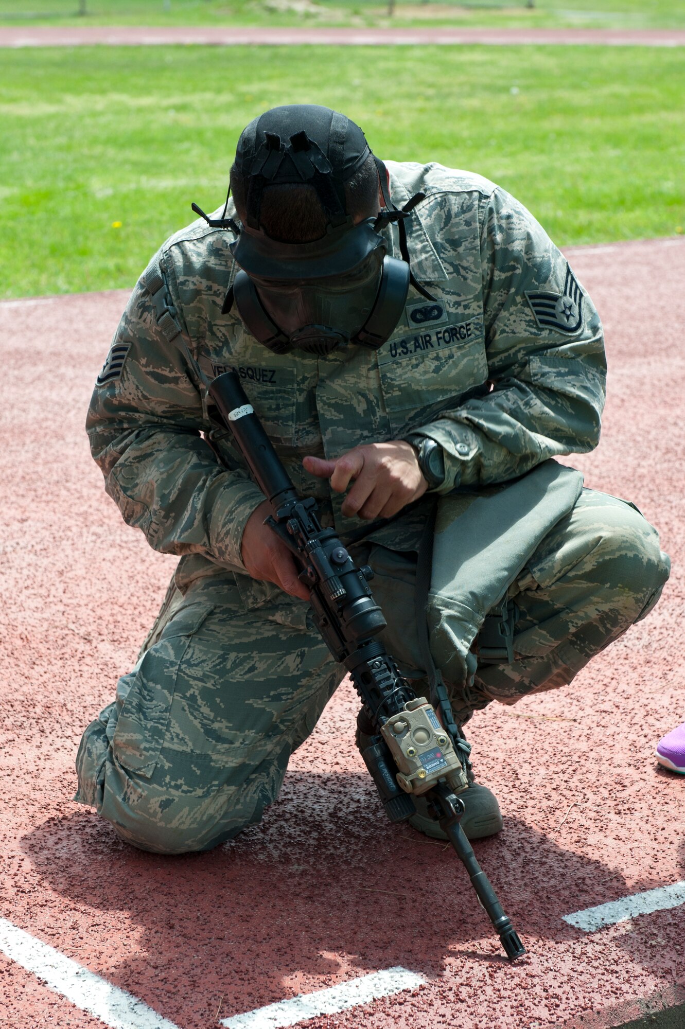 Staff Sgt. Luis Velasquez, 8th Security Forces Squadron, performs an operations check on an M4 carbine during a defenders’ challenge at Kunsan Air Base, Republic of Korea, May 17, 2013. The challenge featured a number of events such as endurance tests and land navigation. (U.S. Air Force photo by Staff Sgt. Jonathan Fowler/Released)