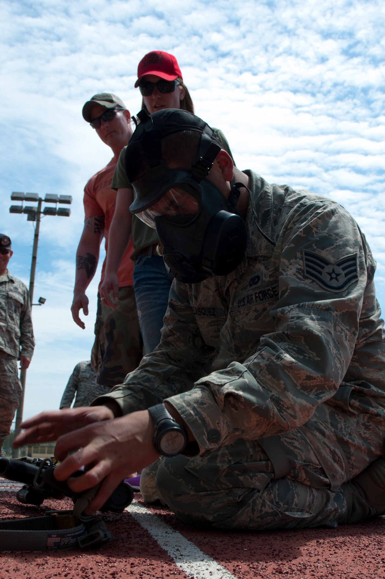 Staff Sgt. Luis Velasquez, 8th Security Forces Squadron, assembles an M4 carbine while wearing his gas mask during a defenders’ challenge at Kunsan Air Base, Republic of Korea, May 17, 2013. Velasquez and his flight were assessed on their ability to quickly assemble the rifle and check for operability. (U.S. Air Force photo by Staff Sgt. Jonathan Fowler/Released)