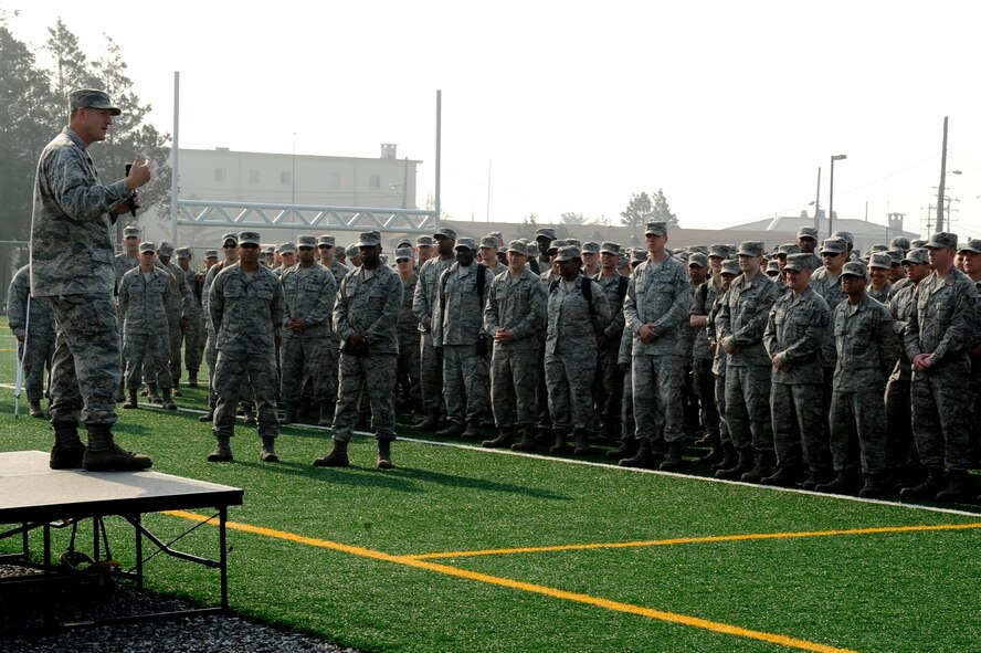 Col. S. Clinton Hinote, 8th Fighter Wing commander, briefs his first commander’s call at Kunsan Air Base, Republic of Korea, May 23, 2013. During the call, the Wolf reminded Airmen to respect each other, because the mission cannot function without each person working together. (U.S. Air Force photo by Senior Airman Marcus Morris/Released)