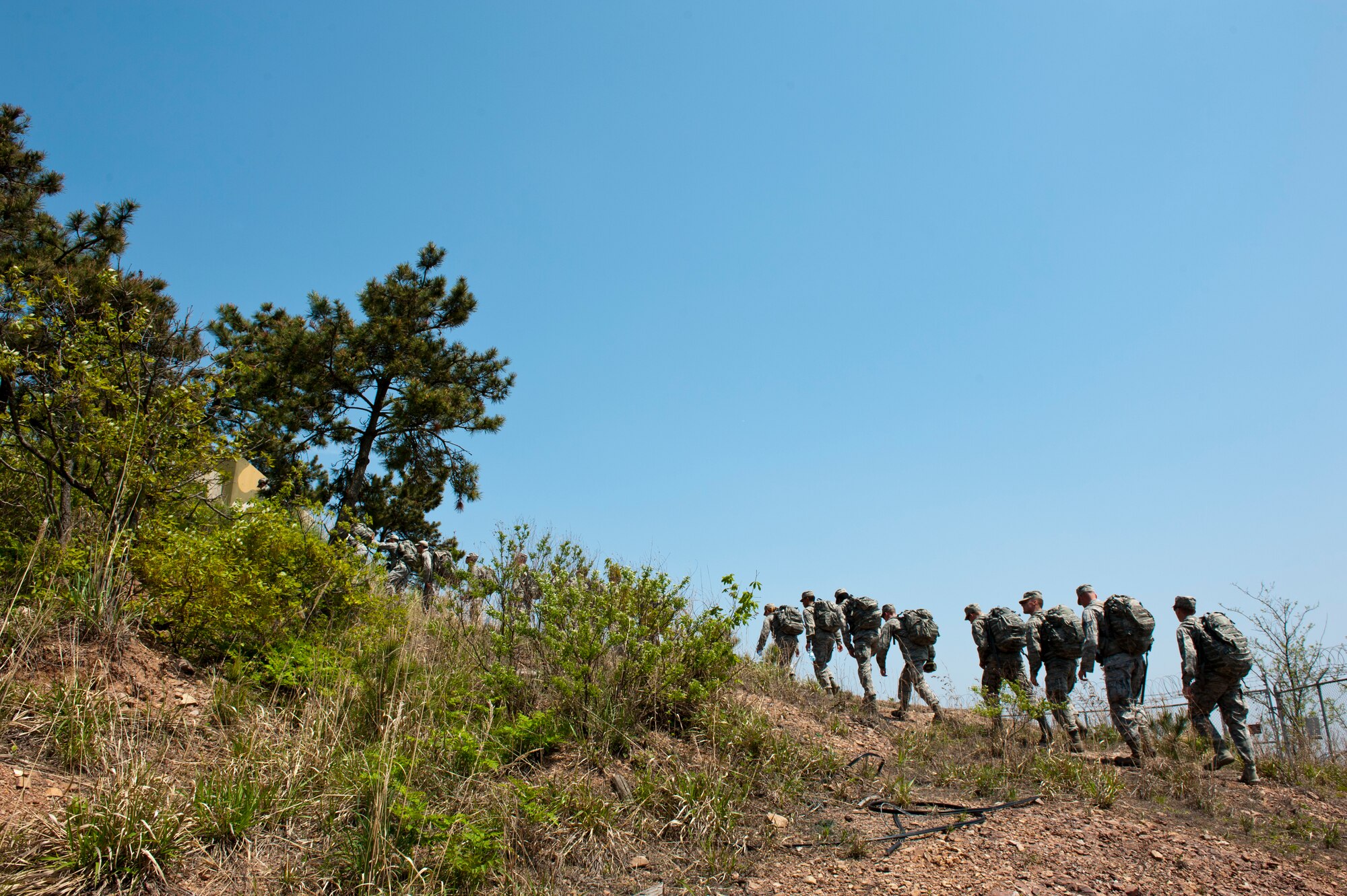 8th Security Forces Squadron defenders finish the last leg of a ruck march at Kunsan Air Base, Republic of Korea, May 13, 2013. The march took security forces members from their main work center to the highest point of the base. (U.S. Air Force photo by Staff Sgt. Jonathan Fowler/Released)