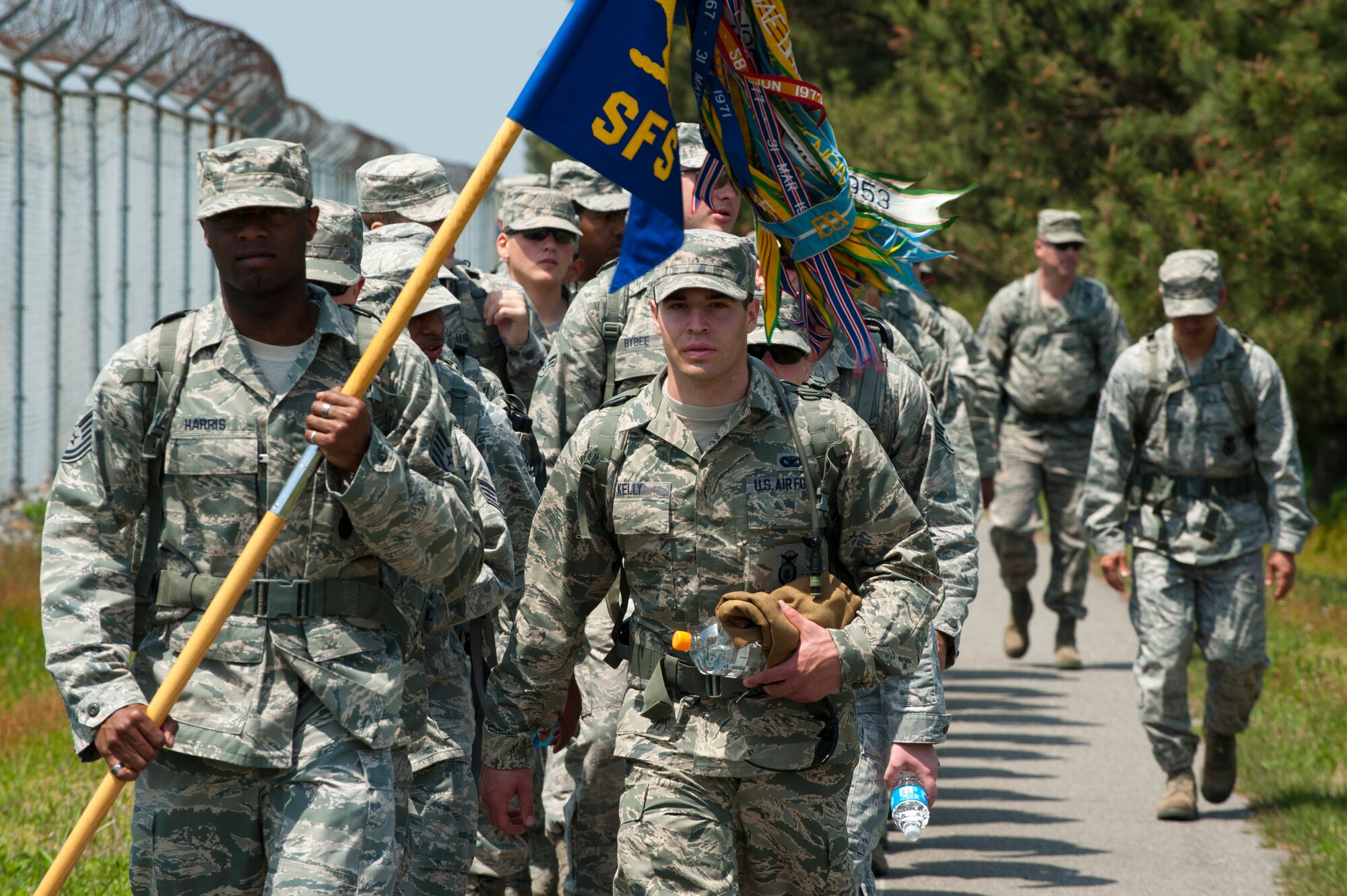 8th Security Forces Squadron defenders march along the perimeter of Kunsan Air Base, Republic of Korea during a National Police Week event, May 13, 2013. All members volunteered for the event which honored fallen law enforcement officers around the country. (U.S. Air Force photo by Staff Sgt. Jonathan Fowler/Released)