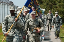 8th Security Forces Squadron defenders march along the perimeter of Kunsan Air Base, Republic of Korea during a National Police Week event, May 13, 2013. All members volunteered for the event which honored fallen law enforcement officers around the country. (U.S. Air Force photo by Staff Sgt. Jonathan Fowler/Released)