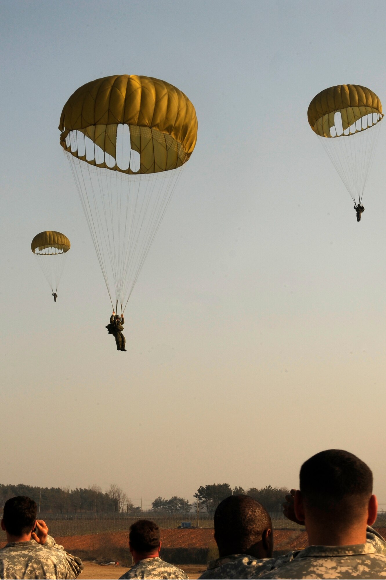 Soldiers from the Republic of Korea army 7th Special Forces Brigade, 35th Special Forces Battalion parachute out of a MC-130P Combat Shadow from Kadena Air Base, Japan as part of the annual FOAL Eagle exercise near Iksan, Republic of Korea, April 4, 2013. FOAL Eagle provides valuable bilateral military training to the participating service members and prepares them for any potential scenario that may arise. (U.S. Air Force photo by Senior Airman Marcus Morris/Released)