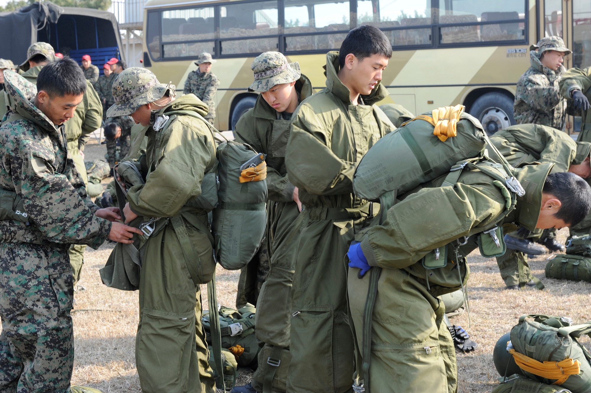 Republic of Korea army 7th Special Forces Brigade, 35th Special Forces Battalion soldiers put on rough terrain suits for jump training at Kunsan Air Base, Republic of Korea, April 4, 2013. This was part of annual FOAL Eagle joint forces training with the U.S. Army 3rd Battalion, 1st Special Forces Group from Joint Base Lewis-McChord, Wash., to ensure the peace and security in the region. (U.S. Air Force photo by Senior Airman Marcus Morris/Released)