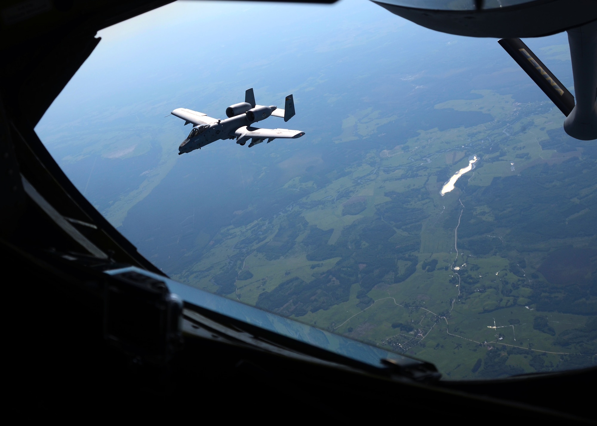 An A-10C Thunderbolt II assigned to the 104th Fighter Squadron flies near a KC-135 Stratotanker at the start of Saber Strike after departing from Amari Air Base, Estonia on June 3, 2013. The KC-1345 provided aerial refueling to A-10C s assigned to the 104th Fighter Squadron during the exercise with the Estonian Air Force and Maryland Air National Guard. Saber Strike 2013 is a multinational exercise involving approximately 2,000 personnel from 14 countries and is designed to improve NATO interoperability and strengthen the relationships between military forces of the U.S., Estonia and other participating nations. (U.S. Air National Guard photo by Staff Sgt. Benjamin Hughes)
