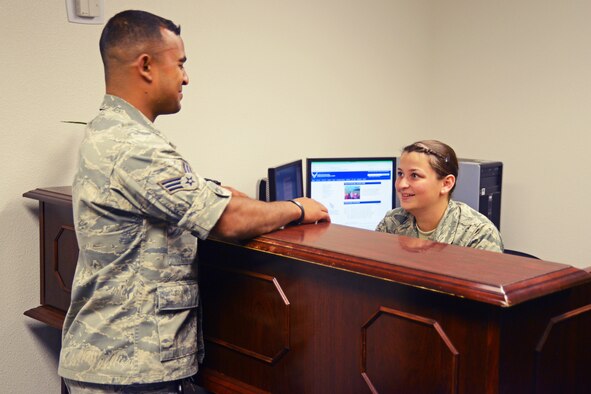 From left: Senior Airman Mahafuz Uddin talks with Airman 1st Class Victoria Gelinas at the Edwards Legal Office.  Both are Air Force paralegals. Edwards, and the Air Force as a whole, are looking for a few good men and women to crosstrain into the paralegal career field. (U.S. Air Force photo by Kenji Thuloweit)