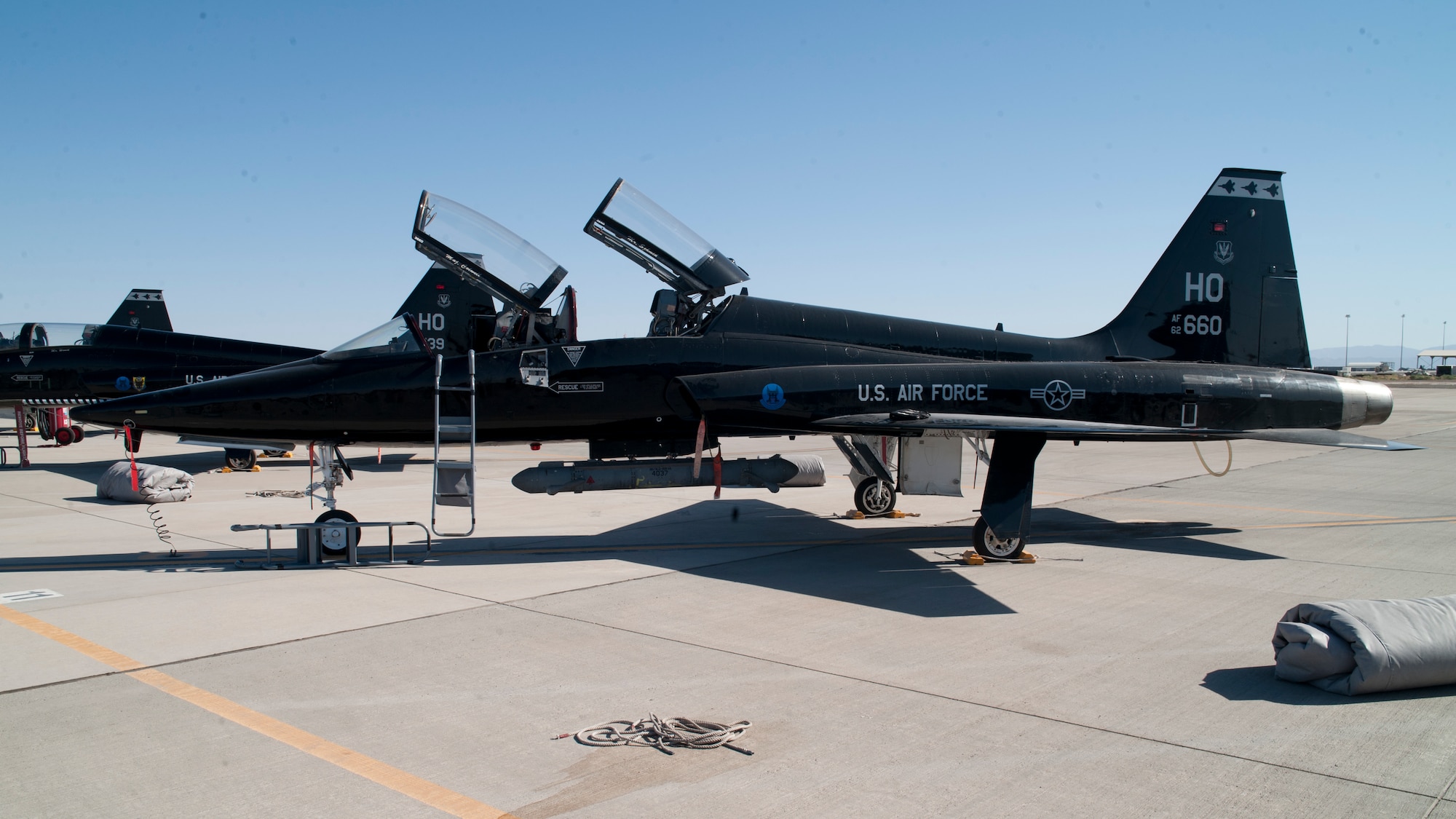 The T-38 Talon is shown equipped with ALQ-188 pod at Holloman Air Force Base, N.M., Jun 4. For the first time, the T-38 has been modified to fit the ALQ-188 Pod for use as a radar jammer. This newest addition to the T-38 will allow assist in its training mission by making it a more effective adversary for the F-22 Raptor during simulated combat exercises. (U.S. Air Force photo by Airman 1st Class Daniel E. Liddicoet/Released)

