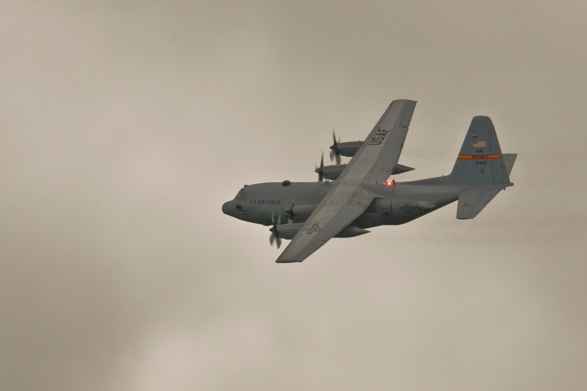 An Illinois Air National Guard C-130H3 Hercules conducts a flyby over the 182nd Airlift Wing in Peoria, Ill., June 2, 2013.  The military transport plane participated in a rare seven-ship taxi in which seven aircraft from the Air National Guard base flew together simultaneously in formation.  (U.S. Air National Guard photo by Staff Sgt. Lealan Buehrer/Released)