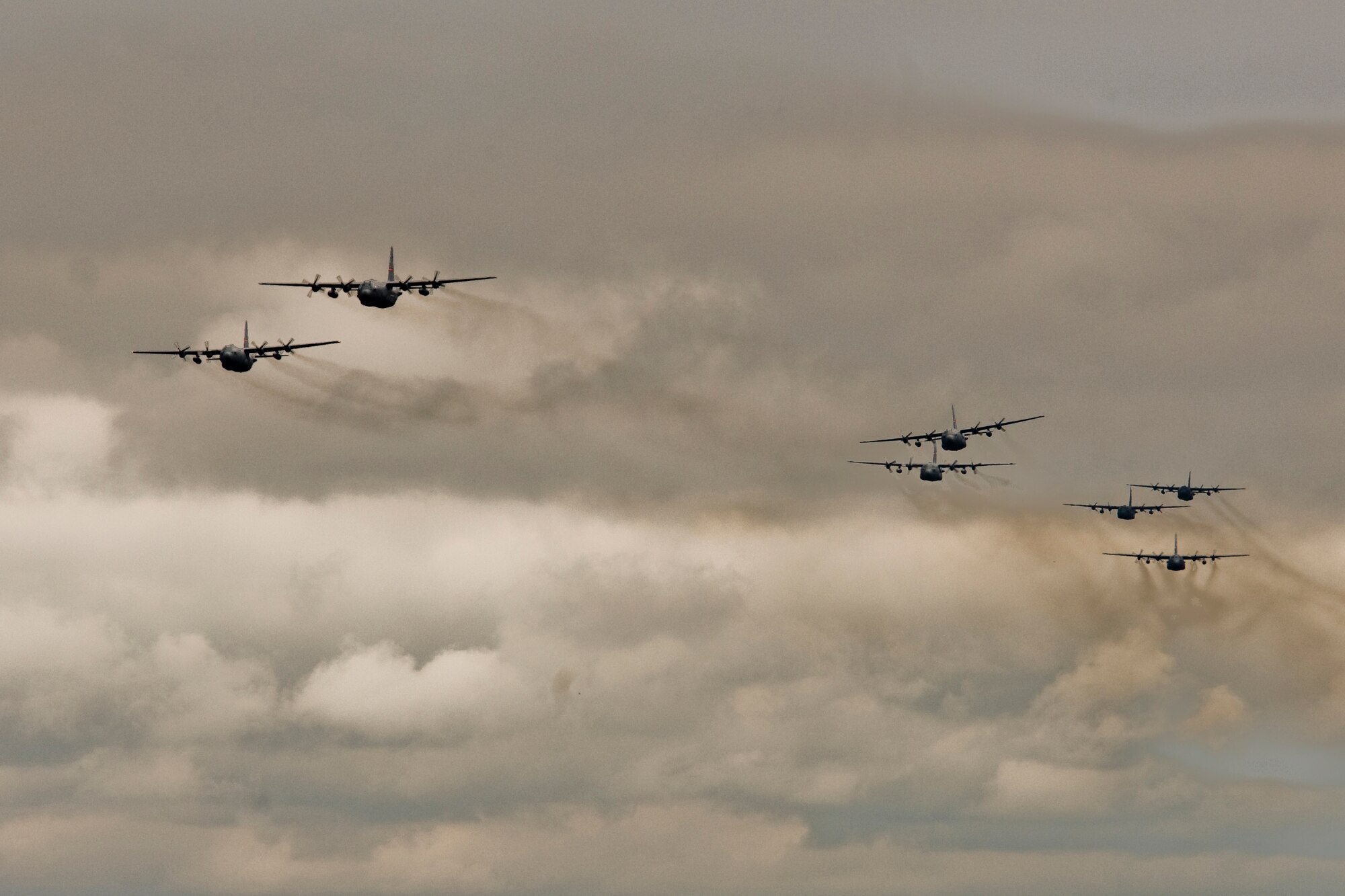 Illinois Air National Guard C-130H3 Hercules aircraft conduct a flyby over the 182nd Airlift Wing in Peoria, Ill., June 2, 2013.  The military transport planes participated in a rare seven-ship taxi in which seven aircraft from the Air National Guard base flew together simultaneously in formation.  (U.S. Air National Guard photo by Staff Sgt. Lealan Buehrer/Released)