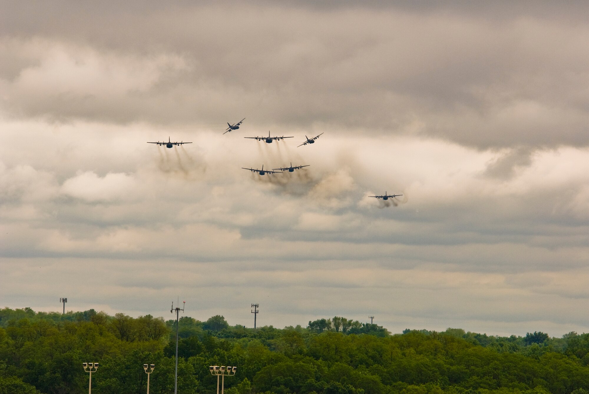 Illinois Air National Guard C-130H3 Hercules aircraft conduct a flyby over the 182nd Airlift Wing in Peoria, Ill., June 2, 2013.  The military transport planes participated in a rare seven-ship taxi in which seven aircraft from the Air National Guard base flew together simultaneously in formation.  (U.S. Air National Guard photo by Staff Sgt. Lealan Buehrer/Released)