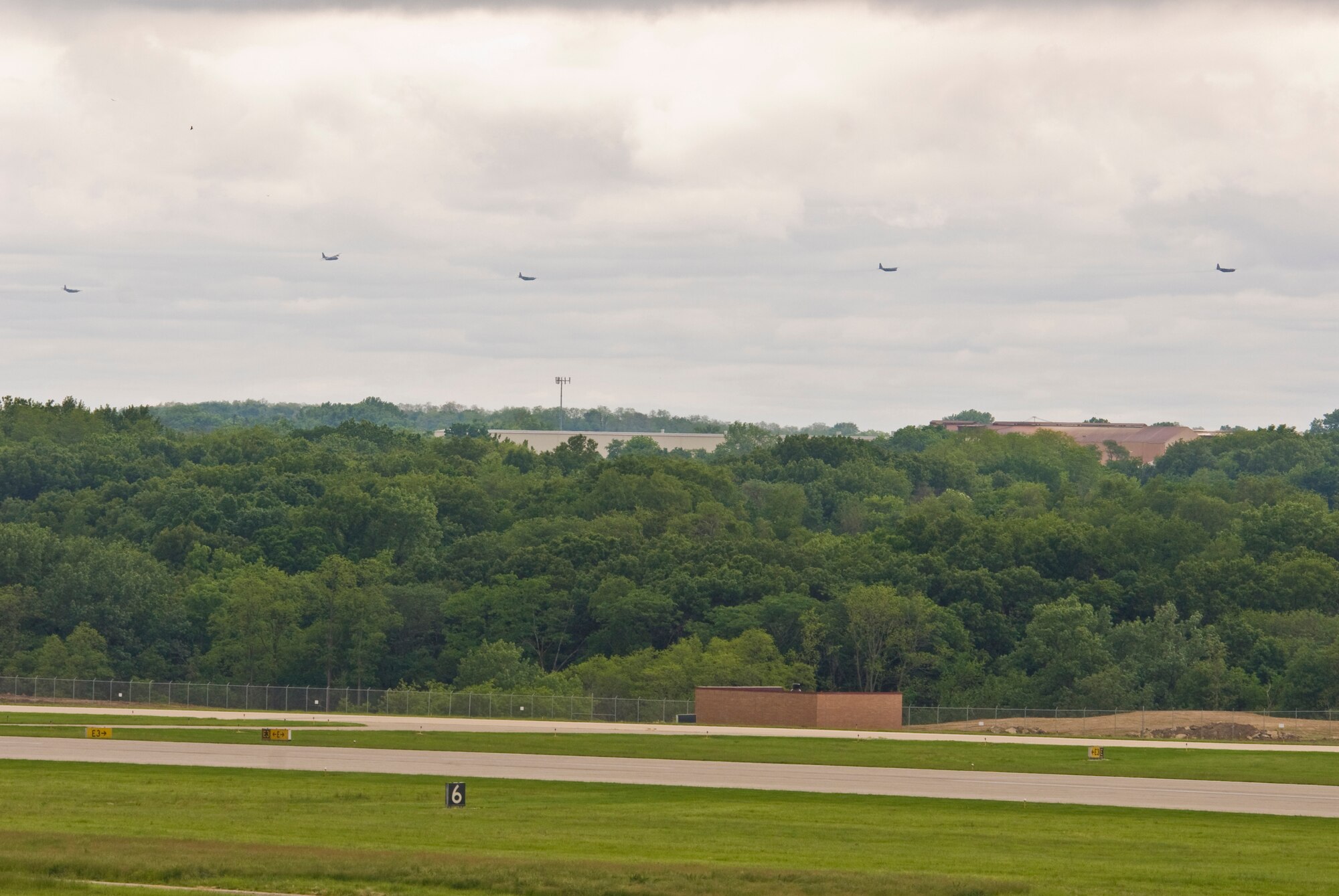 Illinois Air National Guard C-130H3 Hercules aircraft prepare to conduct a flyby over the 182nd Airlift Wing in Peoria, Ill., June 2, 2013.  The military transport planes participated in a rare seven-ship taxi in which seven aircraft from the Air National Guard base flew together simultaneously in formation.  (U.S. Air National Guard photo by Staff Sgt. Lealan Buehrer/Released)