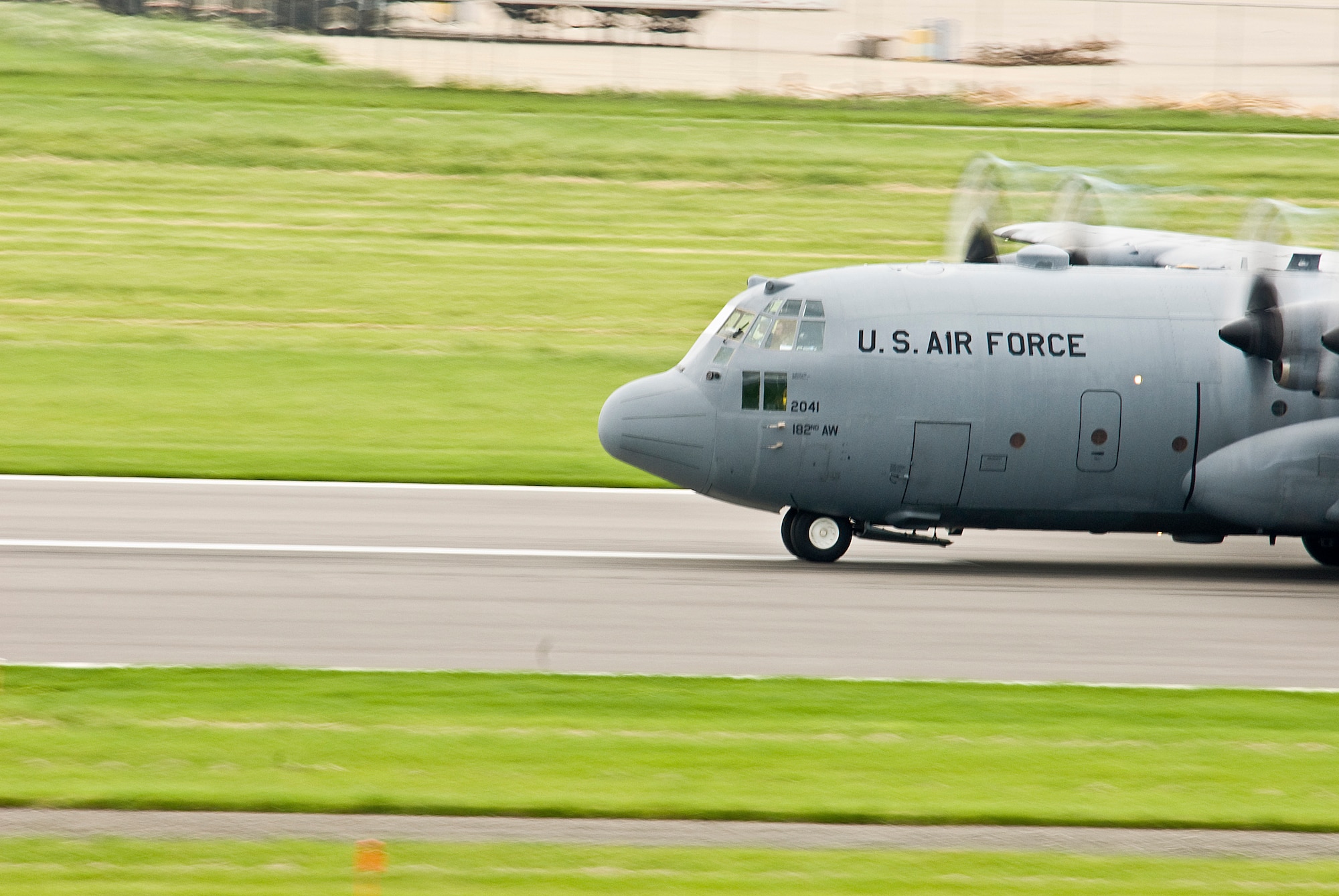 An Illinois Air National Guard C-130H3 Hercules aircraft accelerates to flight at the 182nd Airlift Wing in Peoria, Ill., June 2, 2013.  (U.S. Air National Guard photo by Staff Sgt. Lealan Buehrer/Released)