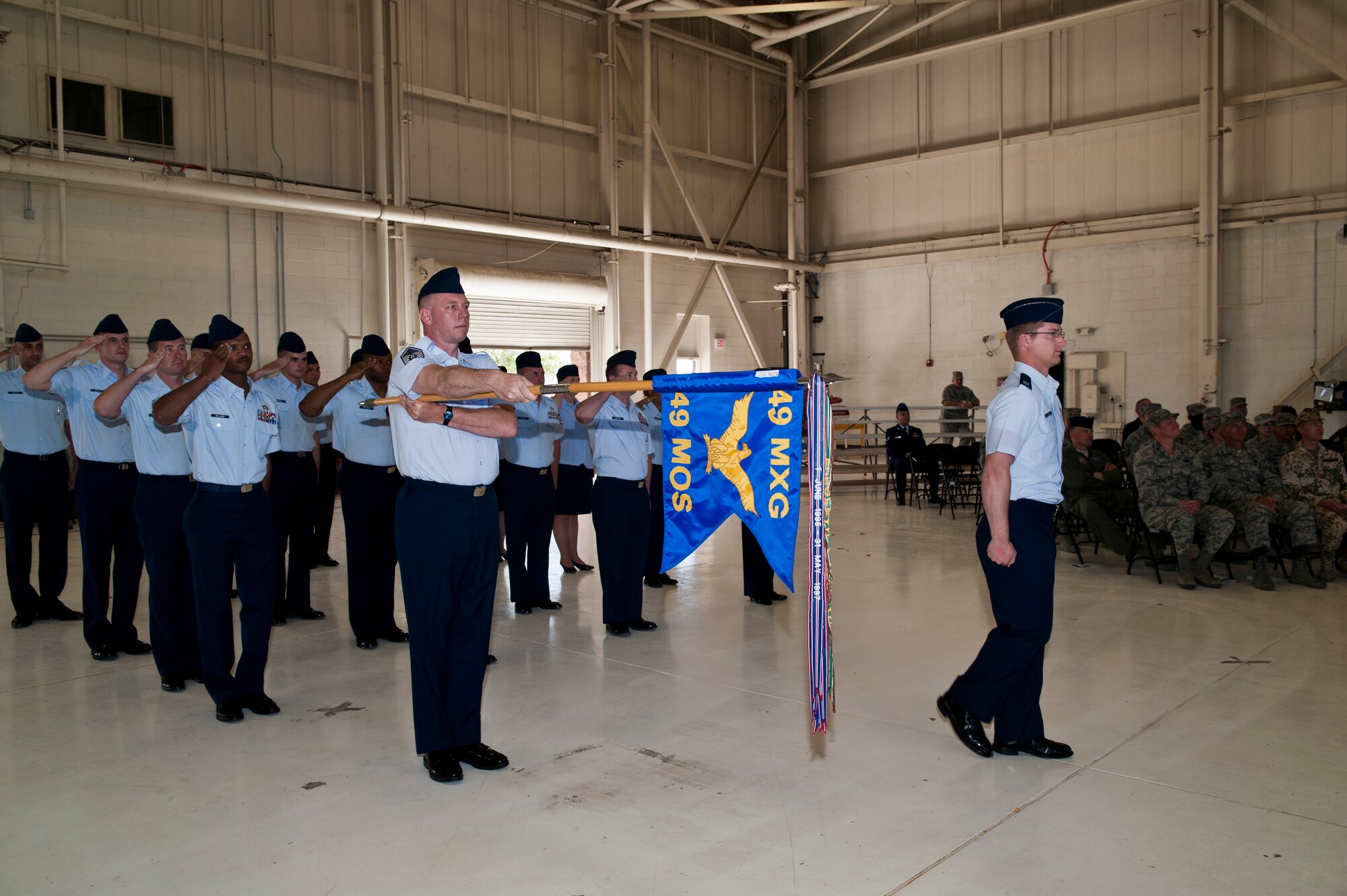 Members of the 49th Maintenance Operations Squadron present arms during the 49th MOS deactivation ceremony at Holloman Air Force Base, N.M., June 4.  The squadron will become part of the 849th Aircraft Maintenance Squadron. (U.S. Air Force photo by Airman 1st Class Leah Murray/Released)  