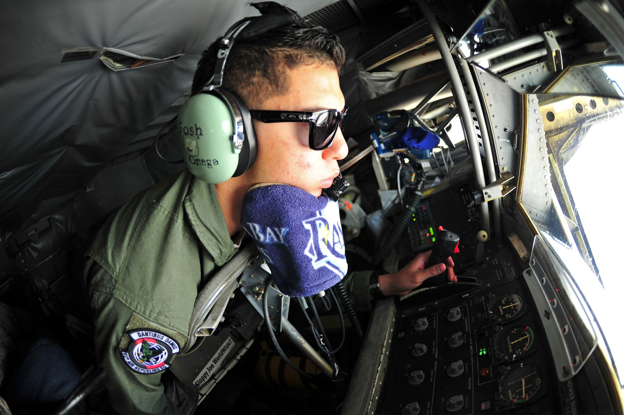 Airman 1st Class Josh Ortega, 92nd Air Refueling Squadron boom operator, refuels a KC-10 Extender from Travis Air Force Base during an air refueling above Western United States, May 31, 2013. The air refueling was part of a quarterly exercise called Advanced Combat Operations Training. (U.S. Air Force photo by Senior Airman Taylor Curry/Released)