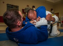 Airmen perform Muay Thai and Brazilian Jiu Jistsu moves during the Asian Pacific Heritage Month luncheon May 30, 2013, at the Chapel Annex at Joint Base Charleston – Air Base, S.C. The luncheon included Asian themed food, drinks, candy, decorations and items for service members and their families to enjoy. (U.S. Air Force photo/ Senior Airman Dennis Sloan)