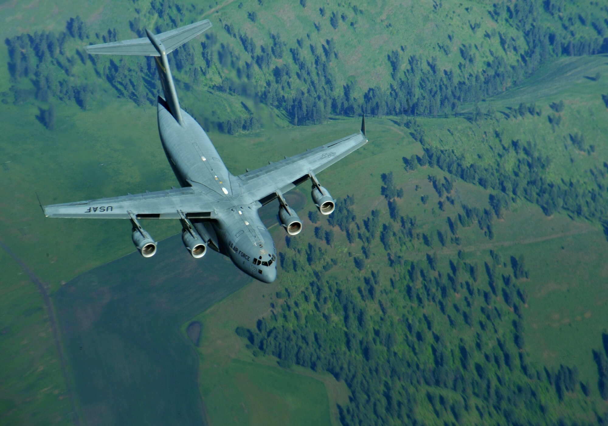 A C-17 Globemaster III from Joint Base Lewis/McChord approaches a KC-135 Stratotanker from Fairchild Air Force Base during an air refueling above Western United States, May 31, 2013. The air refueling was part of a quarterly exercise called Advanced Combat Operations Training. (U.S. Air Force photo by Senior Airman Taylor Curry/Released)