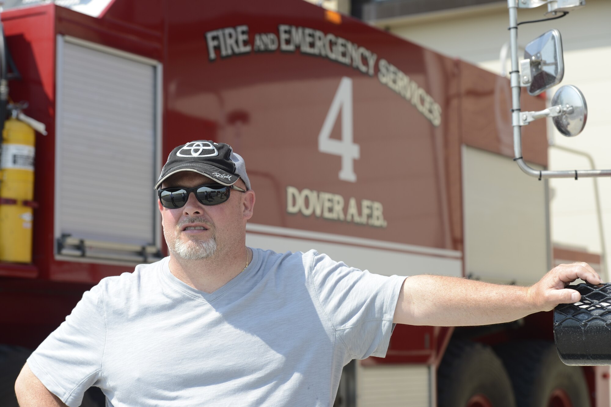 Todd Bodine of ThorSport Racing listens intently to a presentation about Dover's Fire and Emergency Serives section during a visit to the 436th Airlift Wing, Dover Air Force Base, Del., on May 30, 2013. Bodine raced at Dover International Speedway last weekend in the NASCAR Camping World Truck Series Race Lucas Oil 200. (U.S. Air Force photo/Greg L. Davis)