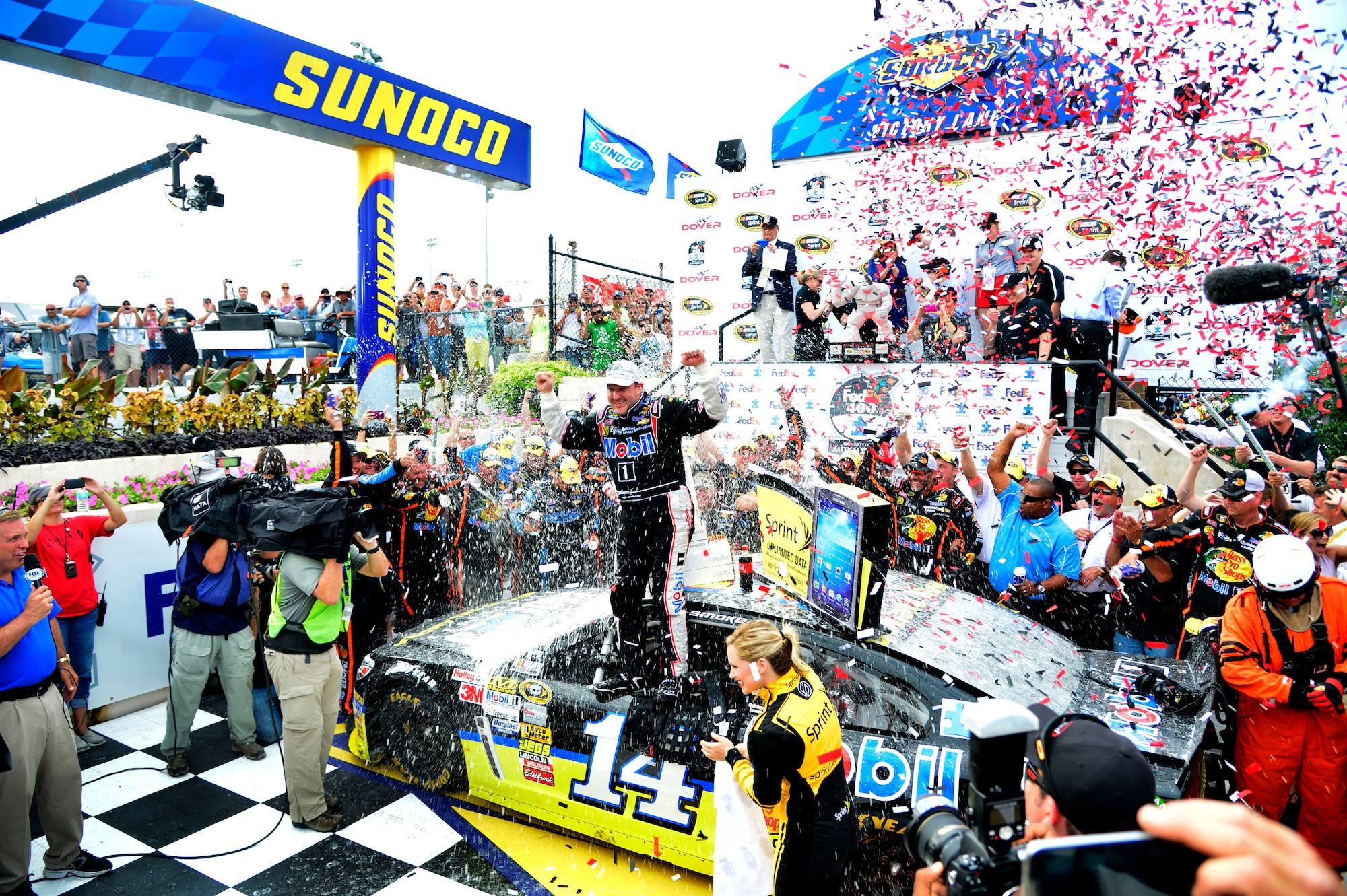 Tony Stewart, driver of the No. 14 Mobil One Chevy, celebrates in Victory Lane after winning the Fed Ex 400 Benefiting Autism Speaks June 2, 2013, at Dover International Speedway in Dover, Del. Stewart ended a 30-race win drought with his victory at the Monster Mile. (U.S. Air Force photo/David Tucker)