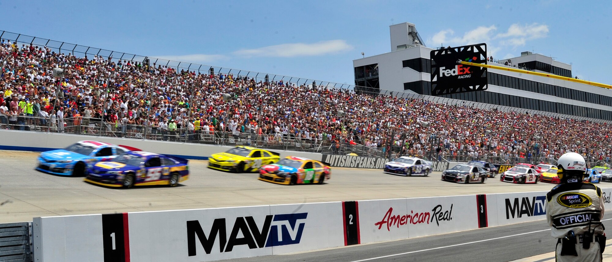 Drivers race down the front stretch into turn one at the start of the Fed Ex 400 Benefiting Autism Speaks June 2, 2013, at Dover International Speedway in Dover, Del. Tony Stewart, driver of the No. 14 Mobil One Chevy, was the winner of the race. (U.S. Air Force photo/Tech. Sgt. Chuck Walker)