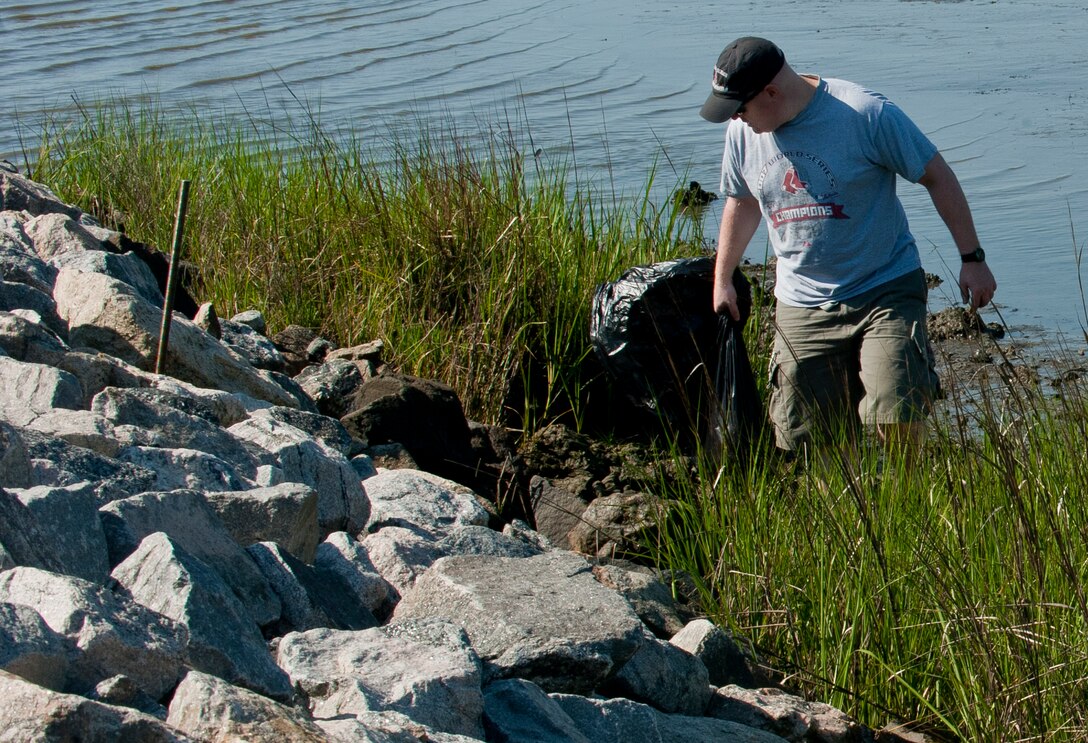 U.S. Air Force Master Sgt. Paul Kosiba, 83rd Network Operations Squadron noncommissioned officer in charge of client security, looks for trash and debris during Clean the Bay Day at Langley Air Force Base, Va., June 1, 2013. Clean the Bay Day has been an annual event for 25 years. (U.S. Air Force photo by Airman 1st Class Kimberly Nagle/Released)