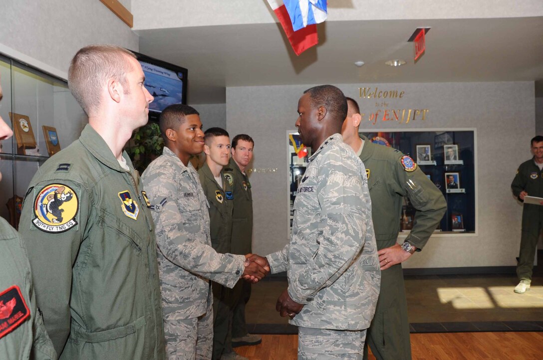 Visiting AETC commander General Edward A.  Rice, coins several airmen from
the 80th Flying Training Wing on May 31, 2013 at Sheppard  Air Force Base,
Texas. The airmen were being congratulated for their outstanding duty performance.
(U.S. Air Force photo/Felton Joshua Jr.)
