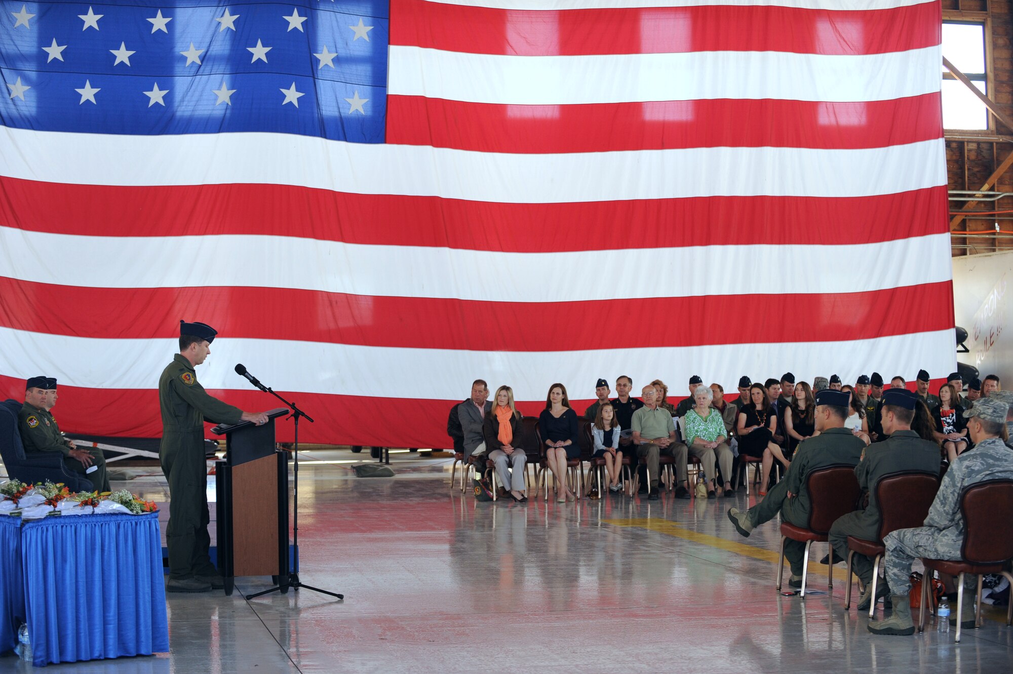 U.S. Air Force Col. Chris Sage, 366th Operations Group commander, addresses the audience at the 391st Fighter Squadron change of command May 23, 2013, at Mountain Home Air Force Base, Idaho. Sage talked about the accomplishments of the 391st FS, known as the Bold Tigers, and welcomed the squadron's new commander, Lt. Col. Richard Dickens. (U.S. Air Force Photo by Airman 1st Class Malissa Lott)(Released)