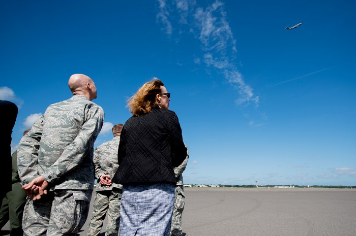 Joint Base Charleston leadership looks skyward as a C-17 Globemaster III performs a fly over May 30, 2013, at JB Charleston – Air Base, S.C. The C-17 was piloted by Lt. Gen. Robert Allardice, Air Mobility Command vice commander. Joint Base Charleston is scheduled to receive the final C-17 later this year, as Boeing completes work on the Air Force’s last Globemaster. The first C-17 to enter the Air Force’s inventory arrived at Charleston Air Force Base in June 1993. The C-17 is capable of rapid strategic delivery of troops and all types of cargo to main operating bases or directly to forward bases in the deployment area. (U.S. Air Force photo/Staff Sgt. Rasheen Douglas)