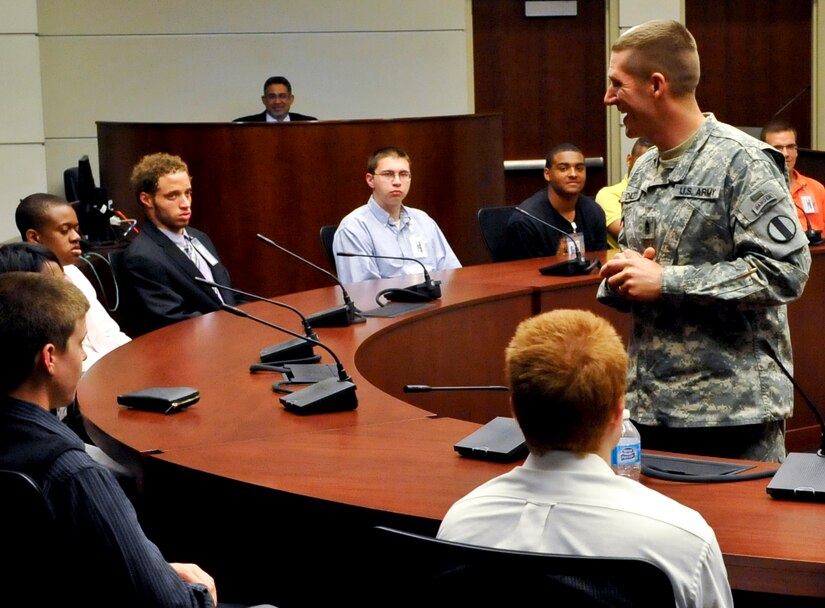 U.S. Army Command Sgt. Maj. Daniel A. Dailey, U.S. Army Training and Doctrine Command command sergeant major, addresses Delayed Entry Program members at TRADOC headquarters at Fort Eustis, Va., May 30, 2013. Dailey talked to the future Soldiers about challenges they will face during Basic Combat Training and the opportunities available to Soldiers in the U.S. Army. (U.S. Air Force photo by Staff Sgt. Wesley Farnsworth/Released) 