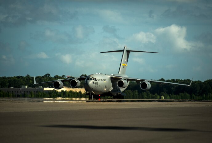 A new C-17 Globemaster III, piloted by Lt. Gen. Robert Allardice, Air Mobility Command vice commander, is delivered May 30, 2013, to Joint Base Charleston – Air Base, S.C. Joint Base Charleston is scheduled to receive the final C-17 later this year, as Boeing completes work on the Air Force’s last Globemaster. The first C-17 to enter the Air Force’s inventory arrived at Charleston Air Force Base in June 1993. The C-17 is capable of rapid strategic delivery of troops and all types of cargo to main operating bases or directly to forward bases in the deployment area. (U.S. Air Force photo/Senior Airman Dennis Sloan)