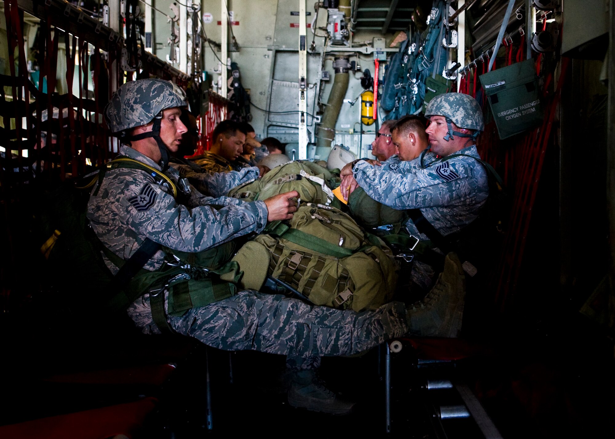 Airmen from the 820th RED HORSE airborne flight wait for pre-flight checks to be completed, May 31, 2013, at Nellis Air Force Base, Nev.  The Airmen were participating in a Joint Forcible Entry Exercise.  The exercise demonstrates the Air Force’s ability to tactically deliver and recover combat forces via air drops and combat landings in a contested environment. (U.S. Air Force Photo by Airman 1st Class Jason Couillard)