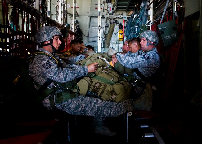 Airmen from the 820th RED HORSE airborne flight wait for pre-flight checks to be completed, May 31, 2013, at Nellis Air Force Base, Nev.  The Airmen were participating in a Joint Forcible Entry Exercise.  The exercise demonstrates the Air Force’s ability to tactically deliver and recover combat forces via air drops and combat landings in a contested environment. (U.S. Air Force Photo by Airman 1st Class Jason Couillard)