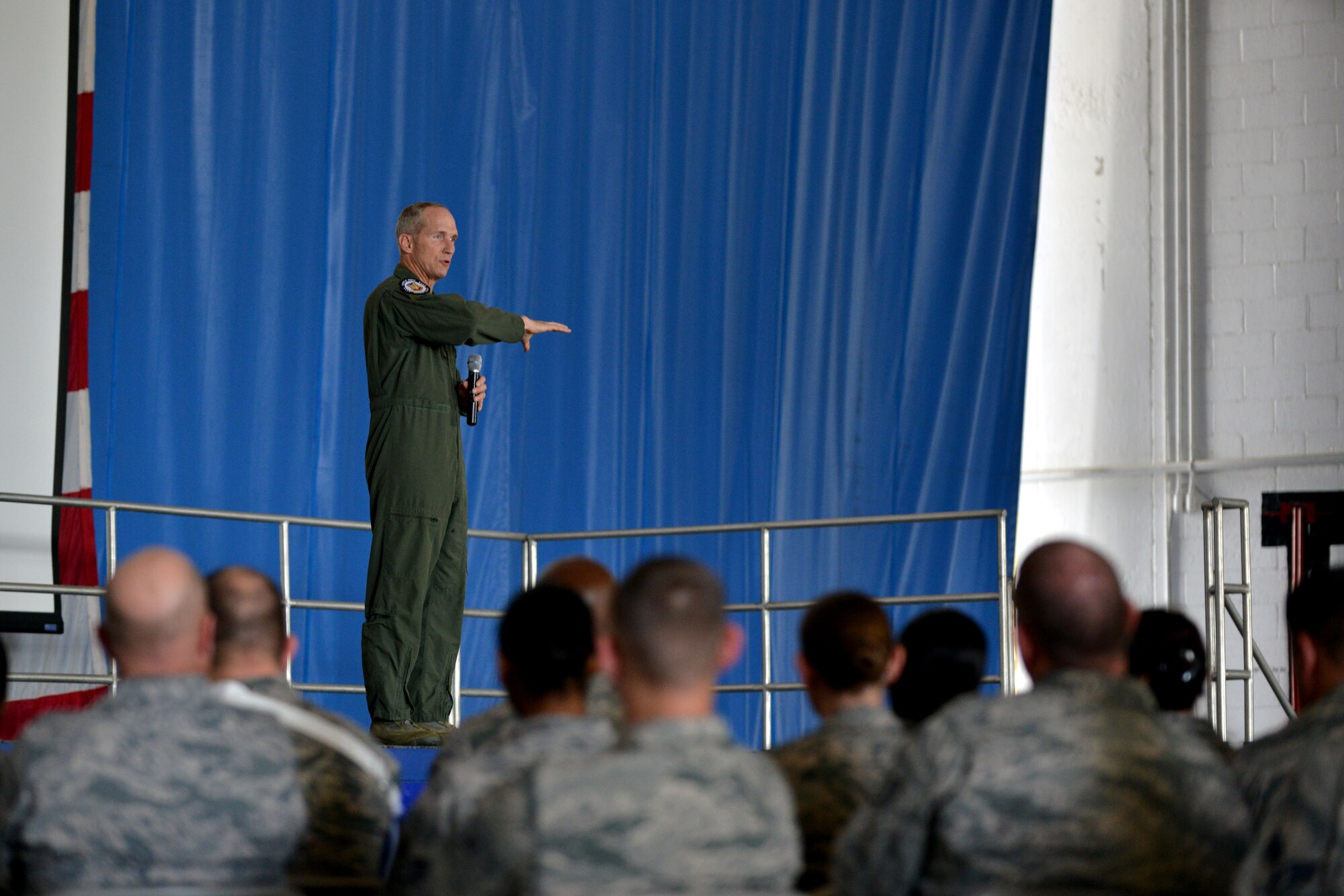 U.S. Air Force Gen. Mike Hostage, commander of Air Combat Command, talks to a crowd of Airmen during an enlisted call, Shaw Air Force Base, S.C., May 31, 2013.  During the enlisted call, Hostage spoke about budget concerns due to sequestration and its effect on combat readiness in ACC and across the Air Force. (U.S. Air Force photo by Airman 1st Class Ashley L. Gardner/Released)