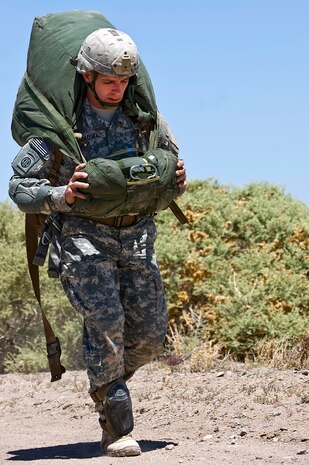 Col. Chuck Masaracchia, 82nd Airborne Division operations officer, runs toward the rally point May 31, 2013, during the Joint Forcible Entry Exercise on the Nevada Test and Training Range. Airmen and Soldiers must pack their parachutes and get to the rally point as quickly as they can. (U.S. Air Force photo by Senior Airman Matthew Lancaster)