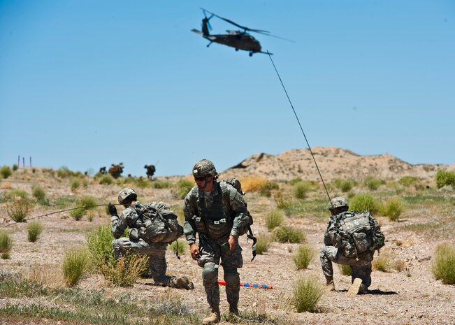 Soldiers from the 82nd Airborne Division 3rd Brigade Combat Team at Fort Bragg, N.C., establish a perimeter during the Joint Forcible Entry Exercise on the Nevada Test and Training Range, Nev. During the exercise soldiers simulated parachuting into a hostile environment in order to achieve their strategic objectives. (U.S. Air Force photo by Staff Sgt. Michael Charles)