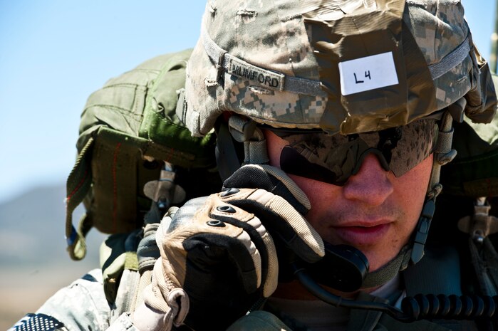 U.S. Army 1st Lt. Alex Mumford, 82nd Airborne Division 3rd Brigade Combat Team signal officer, conducts a radio test following an air-to-ground jump May 31, 2013, during the Joint Forcible Entry Exercise on the Nevada Test and Training Range, Nev. The exercise is the U.S. Air Force Weapons School biannual collaboration that, according to an Air Force fact sheet, exercises the Air Force's ability to tactically deliver and recover combat forces via air drops and combat landings in a contested environment. (U.S. Air Force photo by Staff Sgt. Michael Charles)