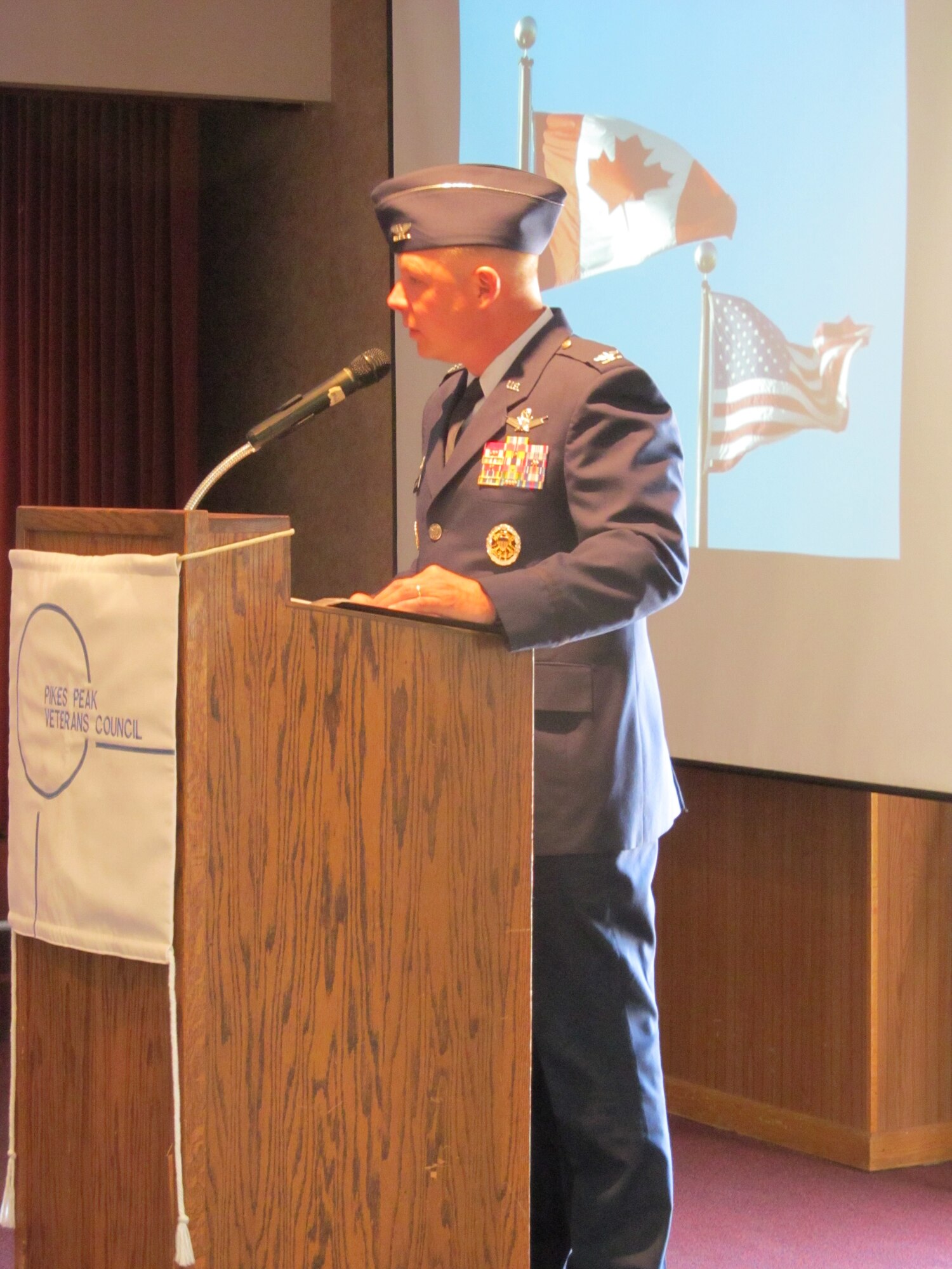 COLORADO SPRINGS, Colo. -- Col. Chris Crawford, 21st Space Wing commander, spoke to a broad audience at the Pikes Peak Veterans Association's Memorial Day commemoration at The Retired Enlisted Association building May 27. Crawford's poignant speech touched audiences with his theme "How do you remember," which spoke of those who have gone before us and sacrificed all so that we may have freedom and prosperity. (U.S. Air Force photo/Jeff Bohn)