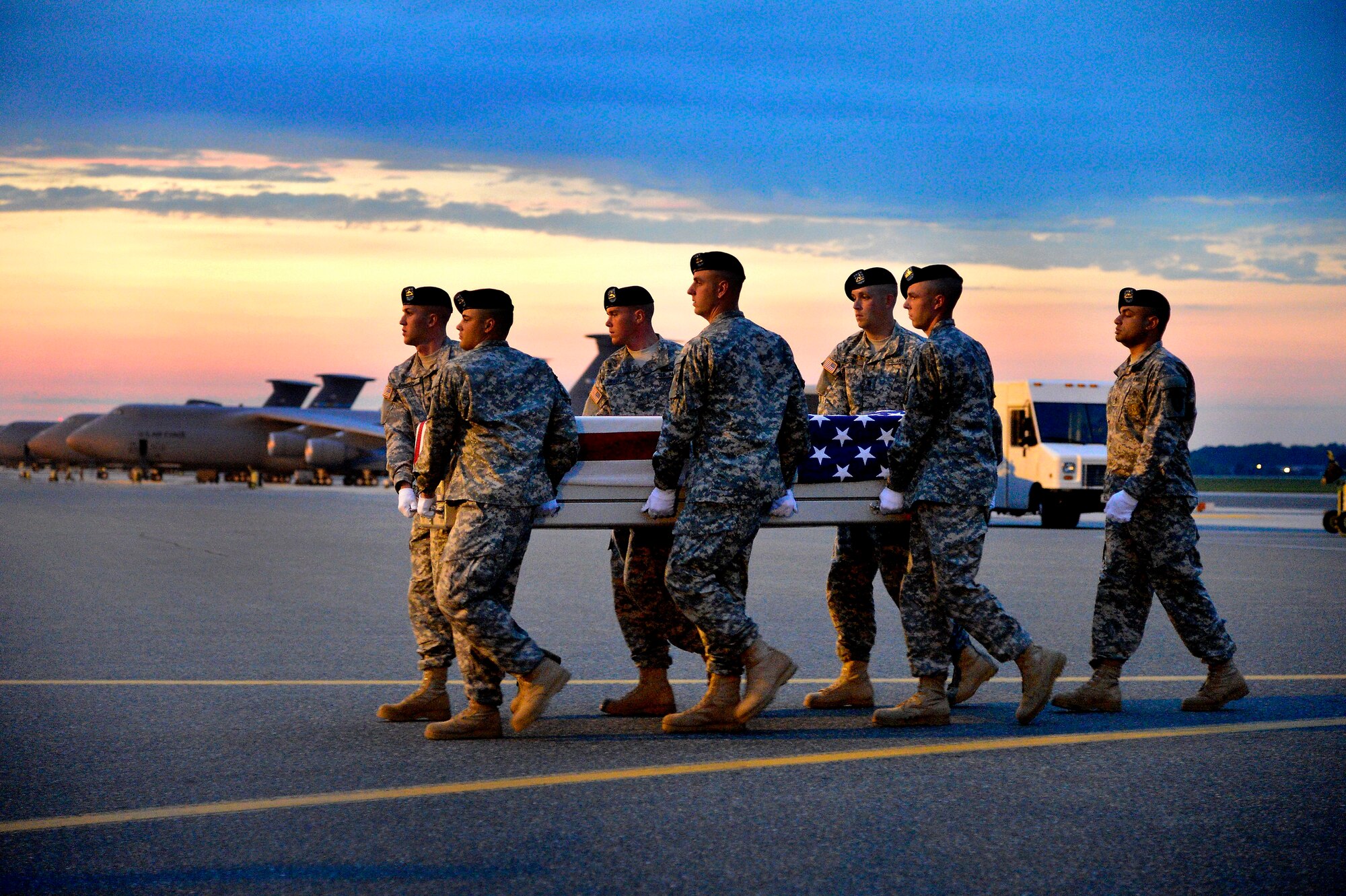 A U.S. Army carry team transfers the remains of Army Sgt. Job M. Reigoux of Austin, Texas, at Dover Air Force Base, Del., on June 3, 2013. Reigoux was assigned to the 3rd Battalion, 69th Armor Regiment, 1st Brigade Combat Team, 3rd Infantry Division, Fort Stewart, Ga.  (U.S. Air Force photo/David Tucker)
