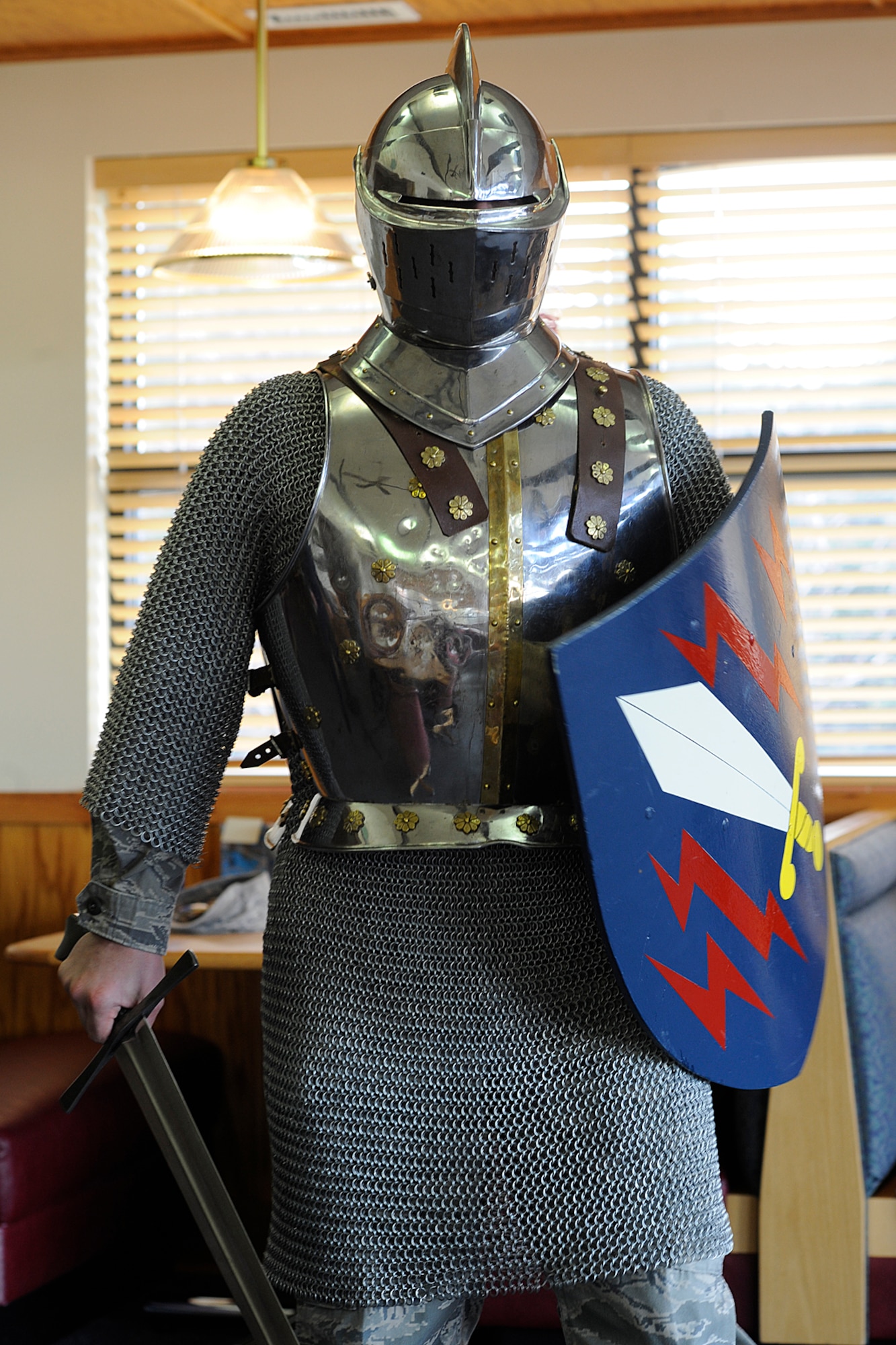 Staff Sgt. Josh Kennedy, 21st Space Wing Judge Advocate office, models the “Iron Mike” mascot in 2010 before the costume moved to its permanent home at the Peterson Air and Space Museum. The costume was named the 21st SW mascot during Guardian Challenge in 1996. (U.S. Air Force photo)