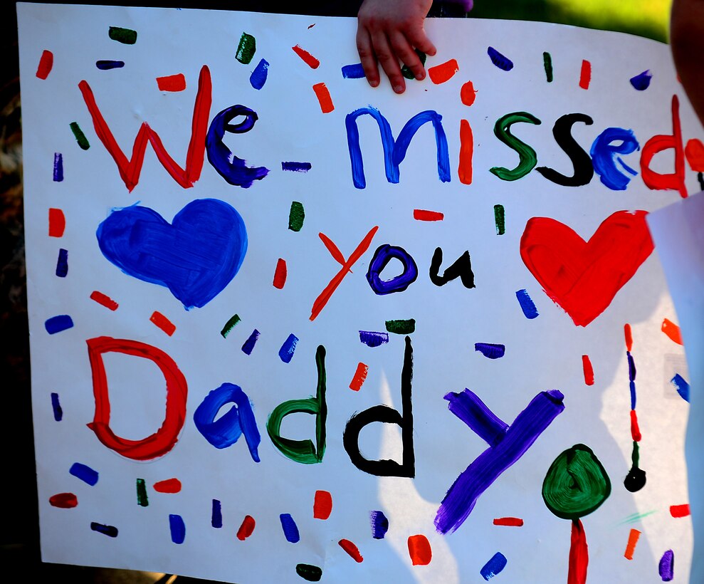 Family and friends greet U.S. Air Force Airmen from the 94th Aircraft Maintenance Unit at Langley Air Force Base, Va., May 29, 2013. Airmen from the 94th AMU and the Virginia Air National Guard’s 192nd Fighter Wing provided stability and security in the Asia-Pacific region.  (U.S. Air Force photo by Senior Airman Kayla Newman/Released)