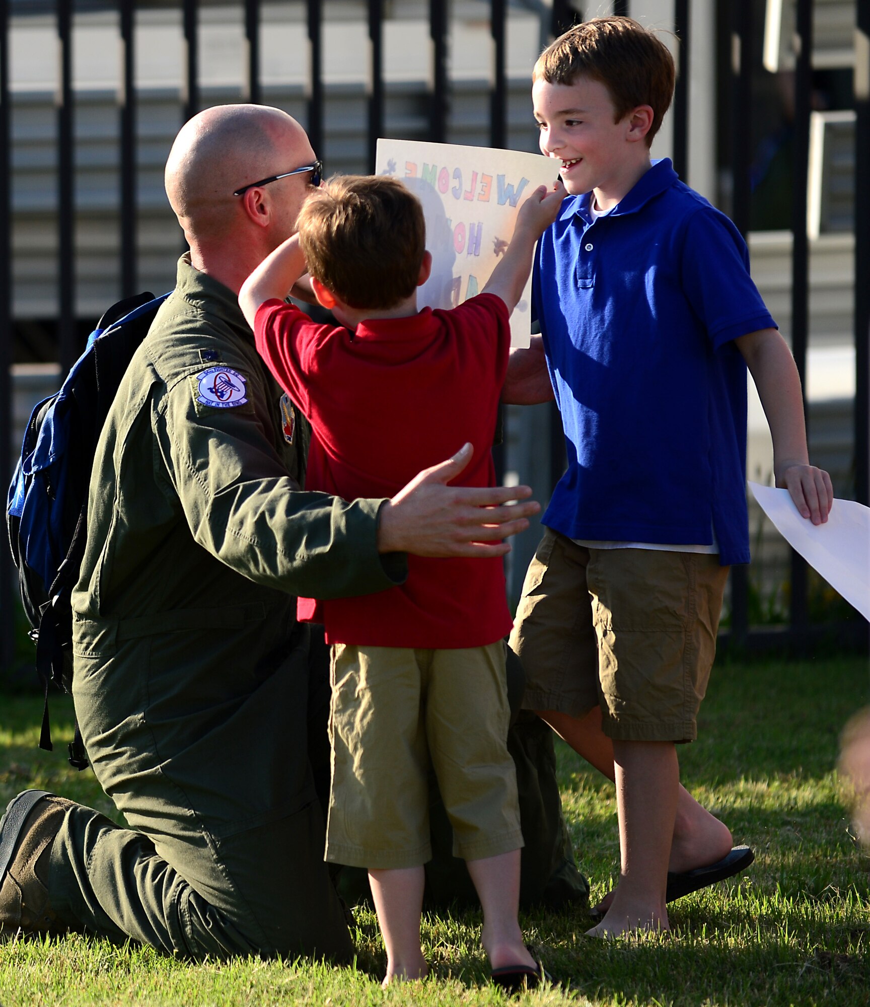 A U.S. Air Force Airman assigned to the 94th Fighter Squadron greets his family at Langley Air Force Base, Va., May 29, 2013, upon returning from a five-month deployment to Kadena Air Base, Japan. The 94th FS, along with the 94th Aircraft Maintenanec Unit, deployed 150 Service members in support of the U.S. Pacific Command’s security obligations in the Western Pacific. (U.S. Air Force photo by Senior Airman Kayla Newman/Released)