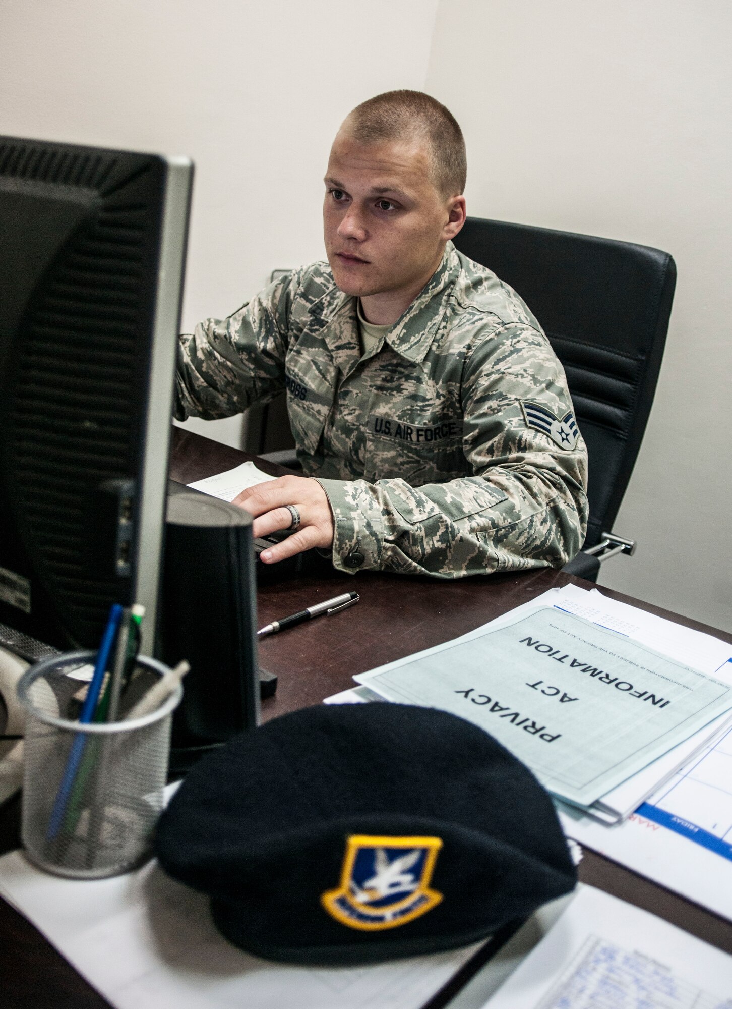 Senior Airman Devon Cross, 39th Comptroller Squadron security forces squadron financial specialist, reviews financial plans in the 39th SFS headquarters building June 4, 2013, at Incirlik Air Base, Turkey. Cross is the only finance personnel here embedded within another unit as part of a trial program known as "All Things Finance."