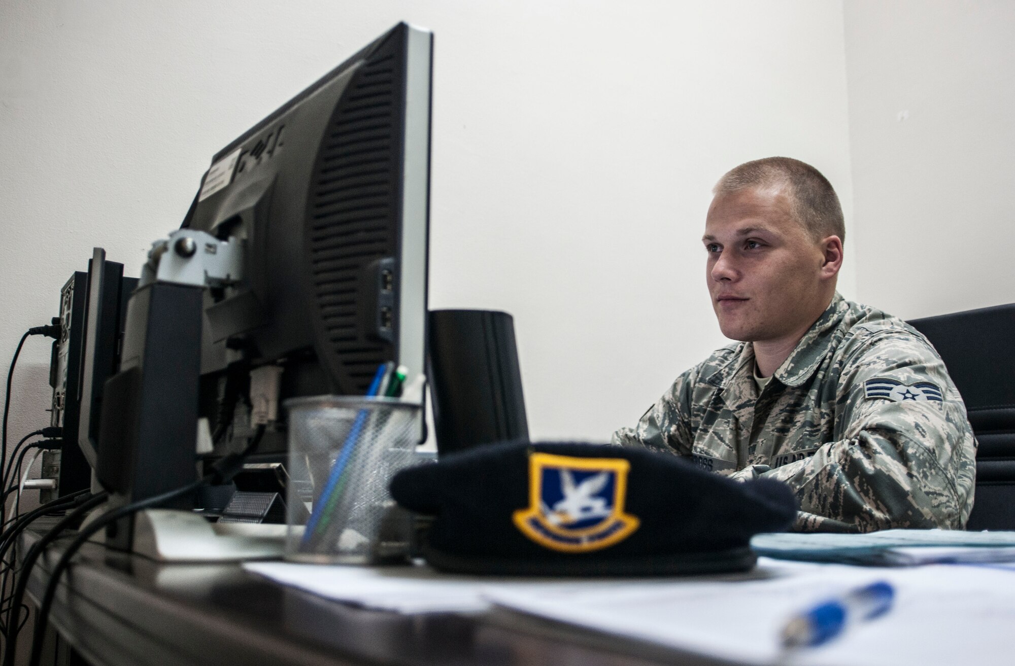 Senior Airman Devon Cross, 39th Comptroller Squadron security forces squadron financial specialist, reviews financial plans in the 39th SFS headquarters building June 4, 2013, at Incirlik Air Base, Turkey. Cross is one of a handful of members in U.S. Air Forces in Europe that has been embedded within other units as part of a trial program known as "All Things Finance."
