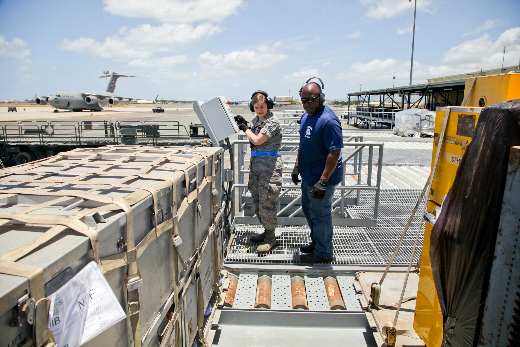 38th Aerial Port Squadron cargo transportation specialist Airman 1st Class Suzanne Steinruck operates cargo movement equipment today at the highline dock at the air freight terminal here at Joint Base Pearl Harbor-Hickam. (U.S. Air Force photo by Staff Sgt. Rashard Coaxum/released)
