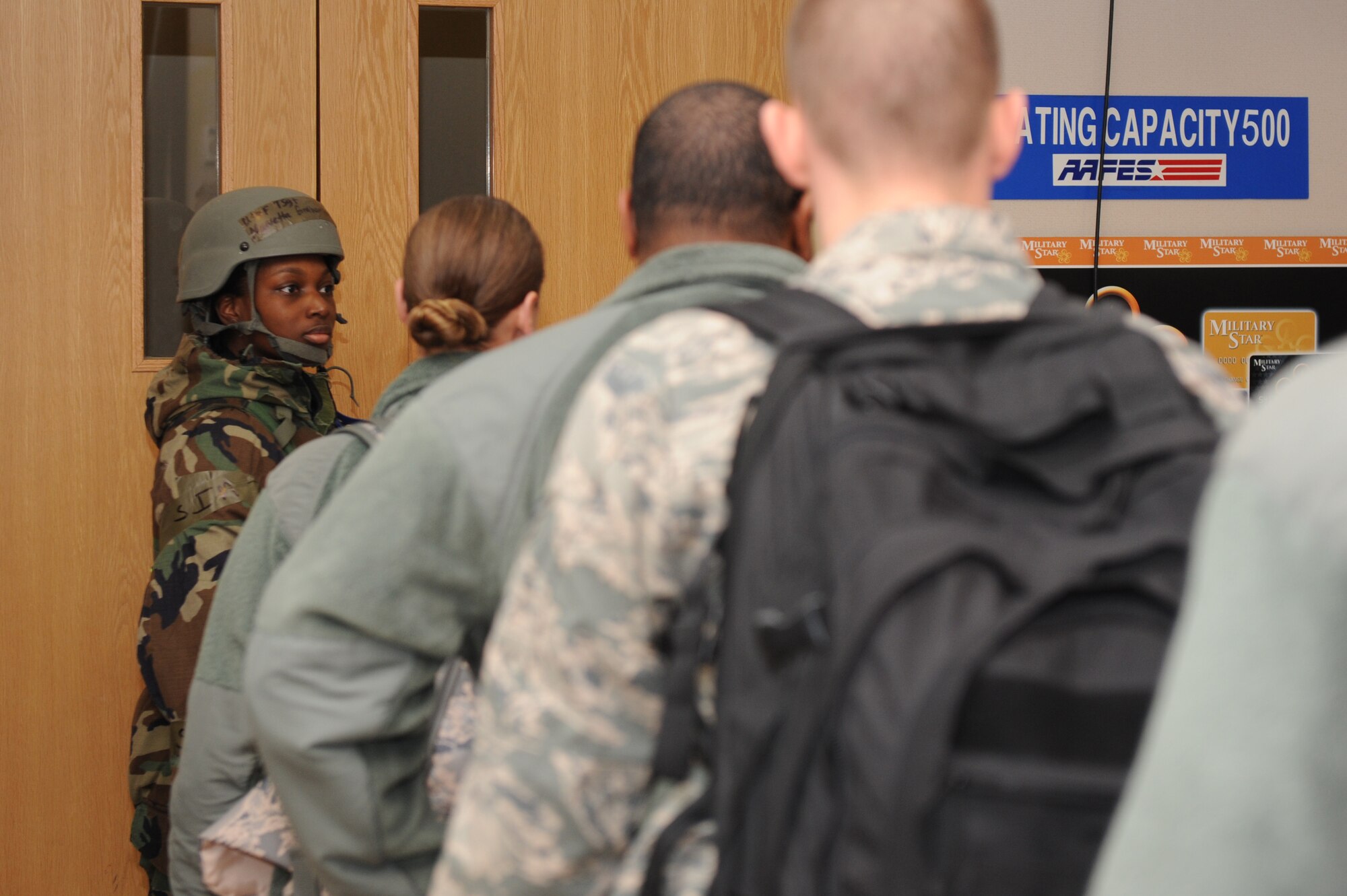Tech. Sgt. Marvetta Graham Harper, 8th Force Support Squadron personnel deployment reception function member, prepares to lead 8th Fighter Wing role-players into the base theater during exercise Beverly Bearcat 13-01 at Kunsan Air Base, Republic of Korea, April 8, 2013. This was part of a training scenario assessing PDRF members’ ability to provide accurate and relevant information to inbound personnel. (U.S. Air Force photo by Staff Sgt. Jonathan Fowler/Released)