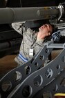 Staff Sgt. Gregory Harrison, 8th Aircraft Maintenance Squadron, ensures a missile is attached to an F-16 Fighting Falcon during an Operational Readiness Inspection at Kunsan Air Base, Republic of Korea, April 8, 2013. The inspection covered both the Airmen’s ability to survive, operate, and support mission capabilities. (U.S. Air Force photo by Senior Airman Marcus Morris/Released)