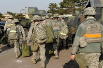 8th Security Forces Squadron Airmen disperse into their Humvees during an Operational Readiness Inspection at Kunsan Air Base, Republic of Korea, April 8, 2013. The ORI evaluates the Airmen’s initial response, employment, mission support and their ability to survive and operate in a hostile environment. (U.S. Air Force photo by Senior Airman Marcus Morris/Released)