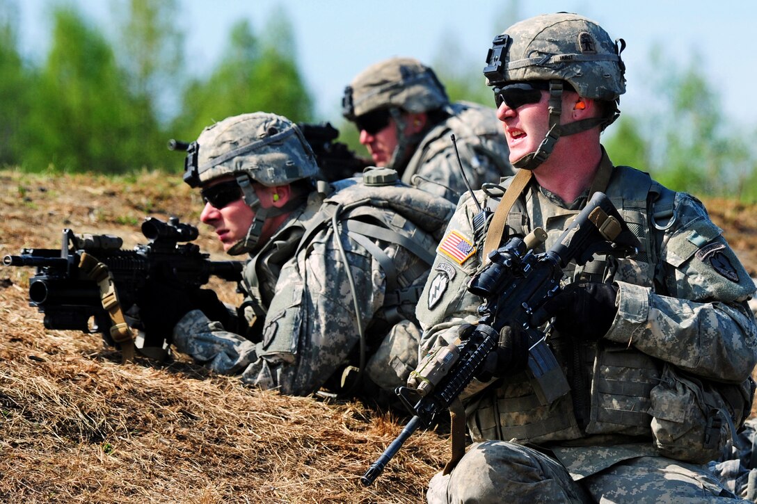 Army Cpl. Johnny Hurst surveys the fire lane during a live-fire and movement-to-contact training exercise on an infantry squad battle course on Joint Base Elmendorf-Richardson, Alaska, May 31, 2013. Hurst is assigned to Company A, 3rd Battalion, Airborne, 509th Infantry Regiment.