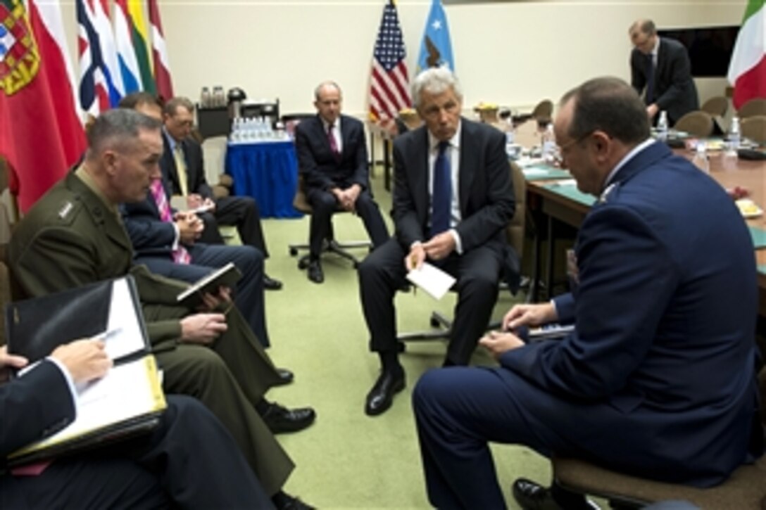 Secretary of Defense Chuck Hagel, second from right, meets informally with Supreme Allied Commander Europe Gen. Philip Breedlove, right, and Commander International Security Assistance Force Gen. Joseph Dunford, left, at NATO headquarters in Brussels, Belgium, on June 4, 2013.  Hagel will later attend a meeting of the North Atlantic Council with NATO leadership.  