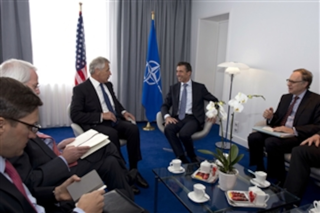 Secretary of Defense Chuck Hagel, third from left, meets with NATO Secretary General Anders Fogh Rasmussen, second from right, and NATO Deputy Secretary General Ambassador Alexander Vershbow, right, at NATO headquarters in Brussels, Belgium, on June 4, 2013.  Hagel, Rasmussen and Vershbow will later attend a meeting of the North Atlantic Council.  